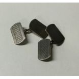 A pair of engine turned silver cufflinks. Approx.