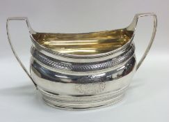 A good Georgian silver boat shaped sugar bowl with