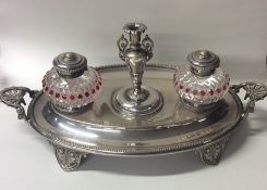 An attractive silver plated two bottle inkstand wi