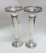 A pair of Edwardian silver tapering spill vases. B