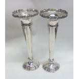 A pair of Edwardian silver tapering spill vases. B