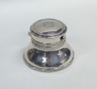 A circular hinged top capstan shaped inkwell toget