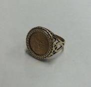 A 9 carat signet ring with 1/10th ounce gold coin.