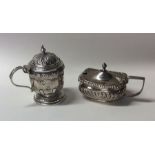 Two silver mustard pots with hinged lids. Approx.