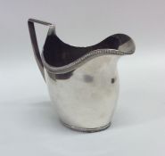 An unusual Dutch silver cream jug. Punched to base