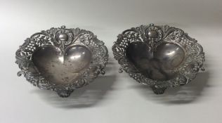 A good pair of Edwardian silver bonbon dishes on s