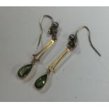 A pair of peridot and pearl drop earrings. Approx.