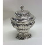 A large Georgian scroll embossed silver sugar bowl