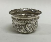 A Victorian silver salt with chased decoration. Ap
