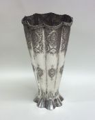 A tall tapering Continental silver vase with shape