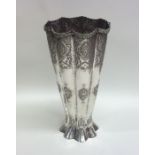 A tall tapering Continental silver vase with shape