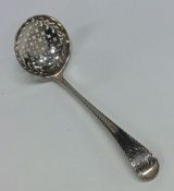 A silver sifter spoon with pierced bowl. London 17