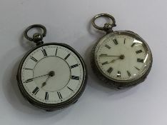 A silver open faced fob watch together with one ot