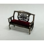 A miniature silver doll's house sofa / pin cushion