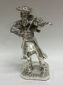A Sterling silver figure of a man playing a violin