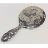 A good quality Edwardian silver mirror decorated w