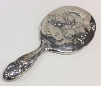 A good quality Edwardian silver mirror decorated w