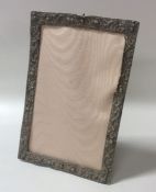 A Chinese silver picture frame decorated with drag