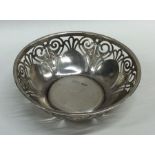 A circular silver bonbon dish with pierced decorat