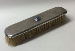 LIBERTY & CO: A small silver hand brush decorated