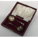 A good cased set of sifter spoons with gilt bowls.