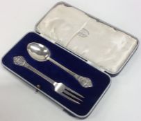 A cased silver two piece christening set. Sheffiel