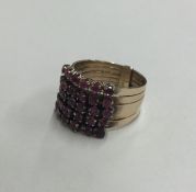 An Antique five row ruby split ring. Approx. 6.2 g