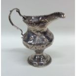 A Georgian silver cream jug with ball rim to gadro