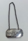 A Georgian silver wine label for 'Madeira'. London