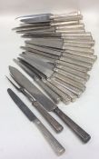 A rare set of 24 silver handled table knives toget