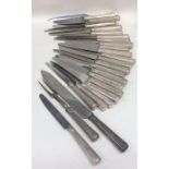 A rare set of 24 silver handled table knives toget
