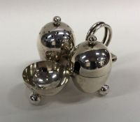 An unusual silver cruet with glass liners and ball