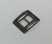 A small plain Chinese silver buckle. Punched to re