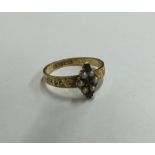 An Antique pearl mounted ring with engraved decora