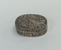 A good quality Chinese silver oval box decorated w