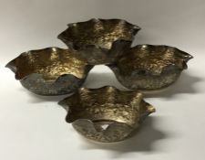 A good set of four Indian silver dishes decorated