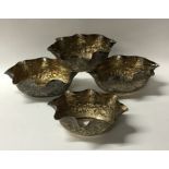 A good set of four Indian silver dishes decorated