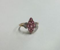 A large 9 carat pink stone and diamond cluster rin