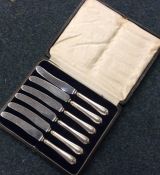 A set of six silver handled knives with steel blad