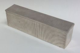 A heavy rectangular silver fluted box with lift-of