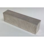 A heavy rectangular silver fluted box with lift-of