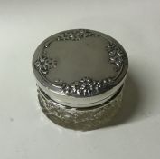 A circular silver and glass dressing table jar dec