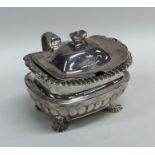 A Georgian half fluted silver mustard pot on claw