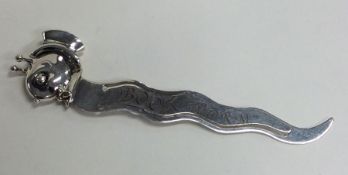 A novelty silver bookmark in the form of a worm in