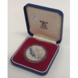 A silver proof coin. Approx. 38 grams. Est. £20 -