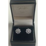 A pair of attractive large diamond daisy head clus