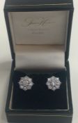 A pair of attractive large diamond daisy head clus