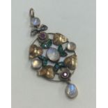 A stylish moonstone and diamond mounted pendant wi