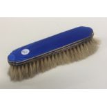 A silver and enamelled clothes brush. Birmingham.