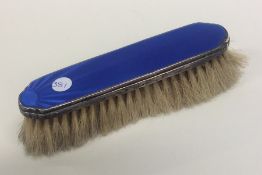 A silver and enamelled clothes brush. Birmingham.